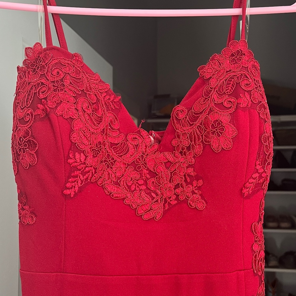 Red mermaid cut dress with slit to mid thigh